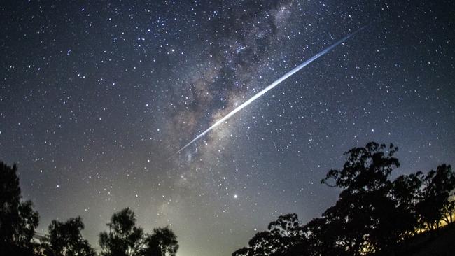 Forty of Elon Musk's Starlink satellites streak through the night sky near Lethbridge. . Picture: Rodd Westwood.