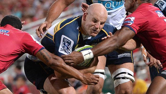 BRISBANE, AUSTRALIA - MARCH 14: Stephen Moore of the Brumbies takes on the defence during the round five Super Rugby match between the Reds and the Brumbies at Suncorp Stadium on March 14, 2015 in Brisbane, Australia. (Photo by Bradley Kanaris/Getty Images)