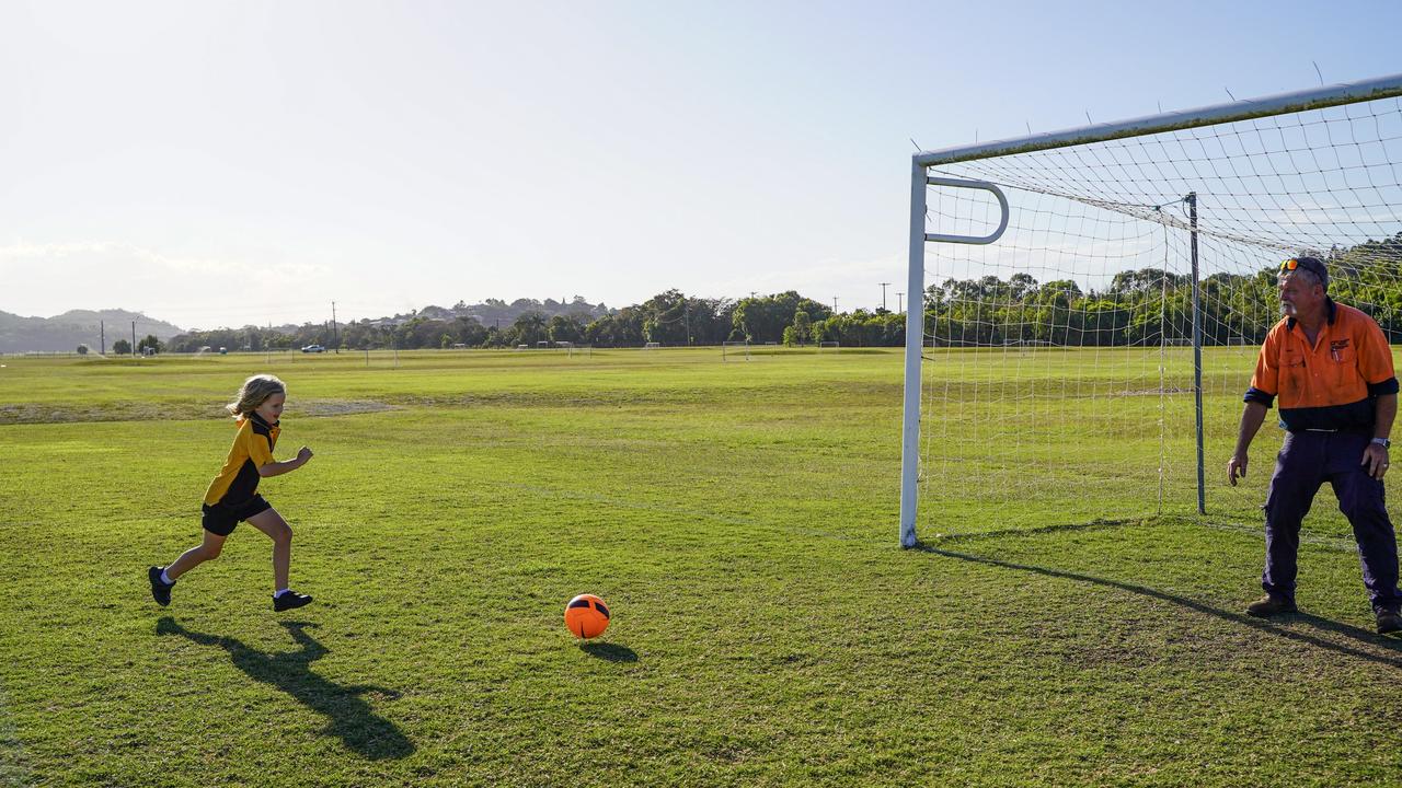 Soccer mad Mackay father of five Scott Mealy is choosing to spend more time with his youngest daughter, Niamh, 7, after 17 years in the president’s seat. Picture: Heidi Petith