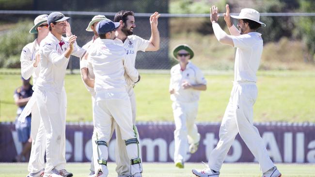 Uni bowler Scott Walter celebrates a wicket. (AAP Image/Renae Droop)