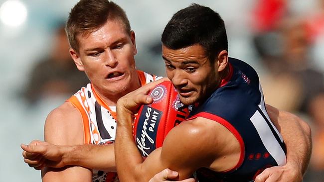 Outgoing Demon Billy Stretch tries to escape the clutches of incoming Demon Adam Tomlinson this year. Picture: Michael Willson/AFL Photos