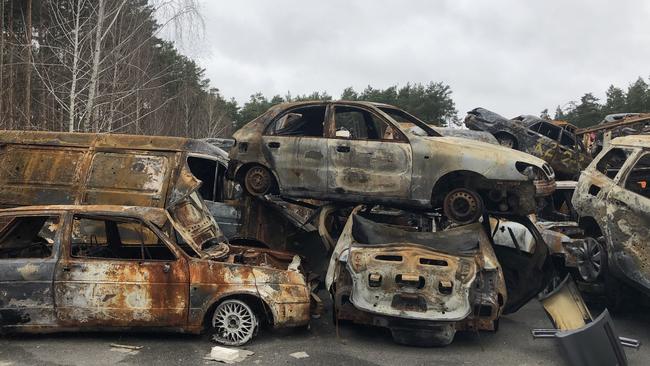 Destroyed cars stacked up on the outskirts of Irpin. April, 2022.