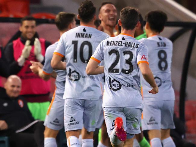 NEWCASTLE, AUSTRALIA - AUGUST 05:  Scott McDonald  of Brisbane Roar celebrates his goal with his team during the round 28 A-League match between the Wellington Phoenix and the Brisbane Roar at McDonald Jones Stadium on August 05, 2020 in Newcastle, Australia. (Photo by Ashley Feder/Getty Images)