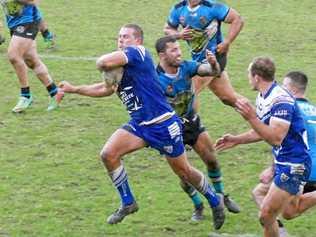 FULL FORCE: Grafton Ghosts captain coach Danny Wicks smashes through the Woolgoolga defence. His offload to centre Dylan Collett gave him a straight run to the line for his third try of the game. Picture: Tim Howard