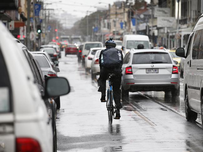 Police on push bikes caught hundreds of drivers using a phone along Sydney Rd. Picture: David Caird