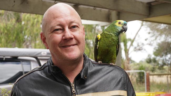 Adam Scott-Gilbertson at his Compton home with his support parrot Chloe. Picture: Jessica Ball