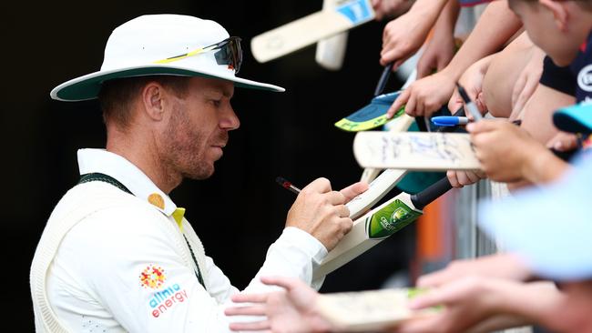 David Warner signs autographs after the second Test victory. Picture: Chris Hyde/Getty Images