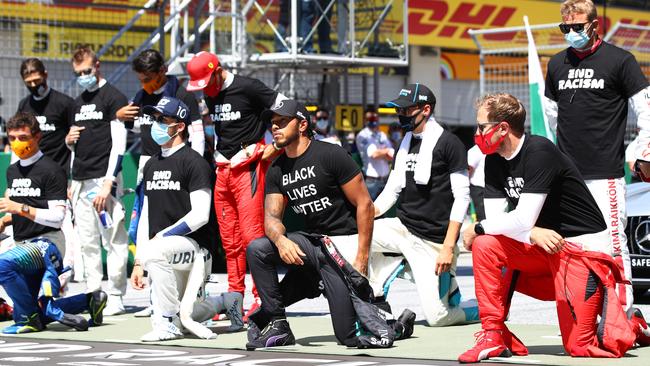 Some drivers remained standing as Lewis Hamilton led other drivers in taking the knee. Picture: Getty Images.