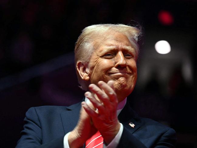 US President-elect Donald Trump reacts during a MAGA victory rally at Capital One Arena in Washington, DC, on January 19, 2025, one day ahead of his inauguration ceremony. (Photo by Jim WATSON / AFP)