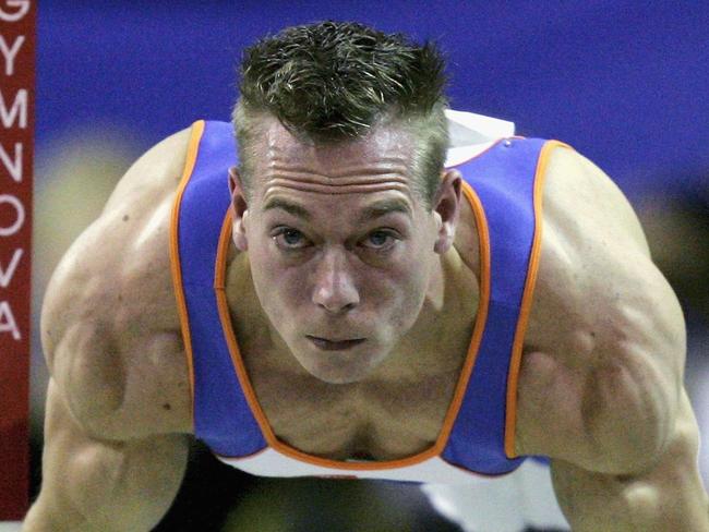 ARHUS, DENMARK - OCTOBER 20: Yuri van Gelder of Netherlands performs on the rings in the the mens individual finals during the World Artistic Gymnastics Championships at the NRGi Arena on October 20, 2006 in Arhus, Denmark. (Photo by Friedemann Vogel/Bongarts/Getty Images)