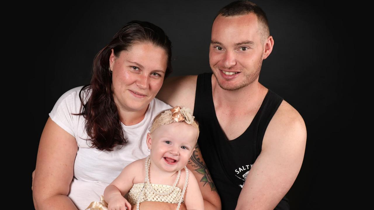 Tributes have flowed for Warwick man Troy Hearnden, 31, whose body was pulled from floodwaters on Monday afternoon. He is pictured here with partner Arlett Harvey and their daughter Amelia. Picture: contributed