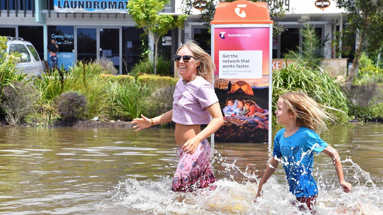 Ernest Ave and Hilton Tce, Tewantin, remains closed as residents prepare for more rain and heavy flooding to hit the Sunshine Coast. Holi and Freddie Broman. Picture: Patrick Woods.