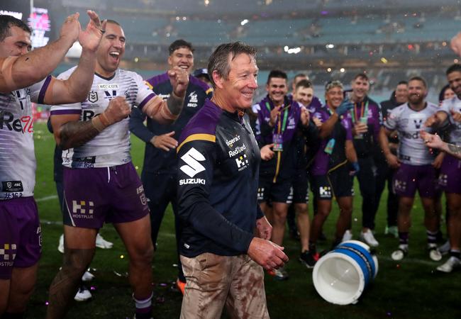 Storm coach Craig Bellamy has Gatorade poured over him after winning the 2020 NRL grand final.