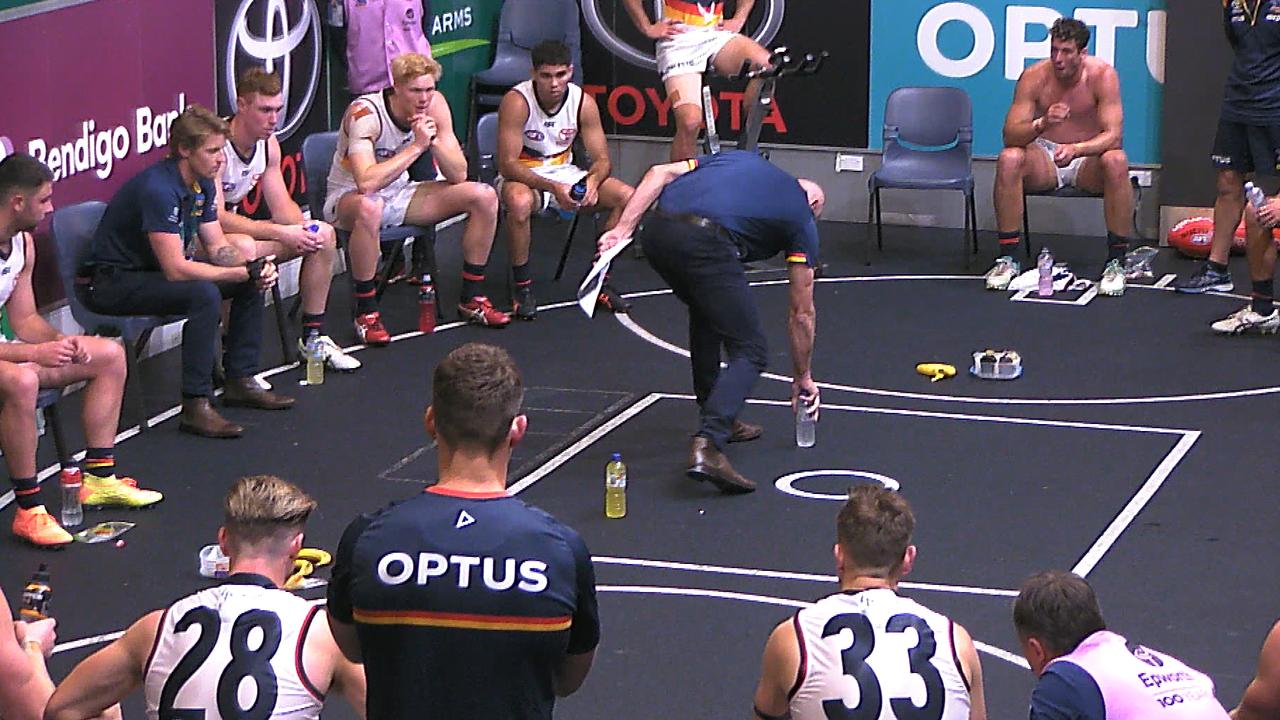 Matthew Nicks took Crows players through some issues at half-time … using water bottles as props.