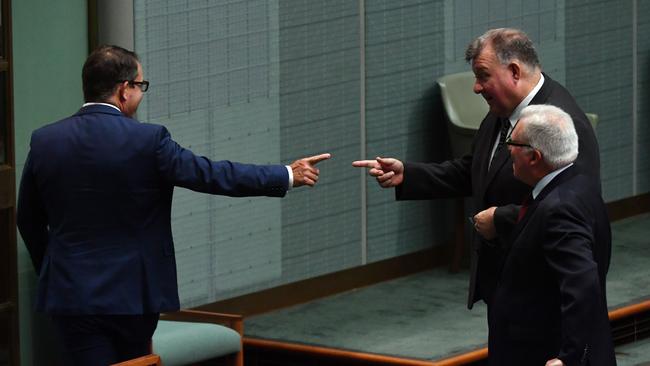 Member for Hughes Craig Kelly, right, gestures to Labor MP Luke Gosling during the opening of House of Representatives at Parliament House today. Picture: Sam Mooy/Getty Images