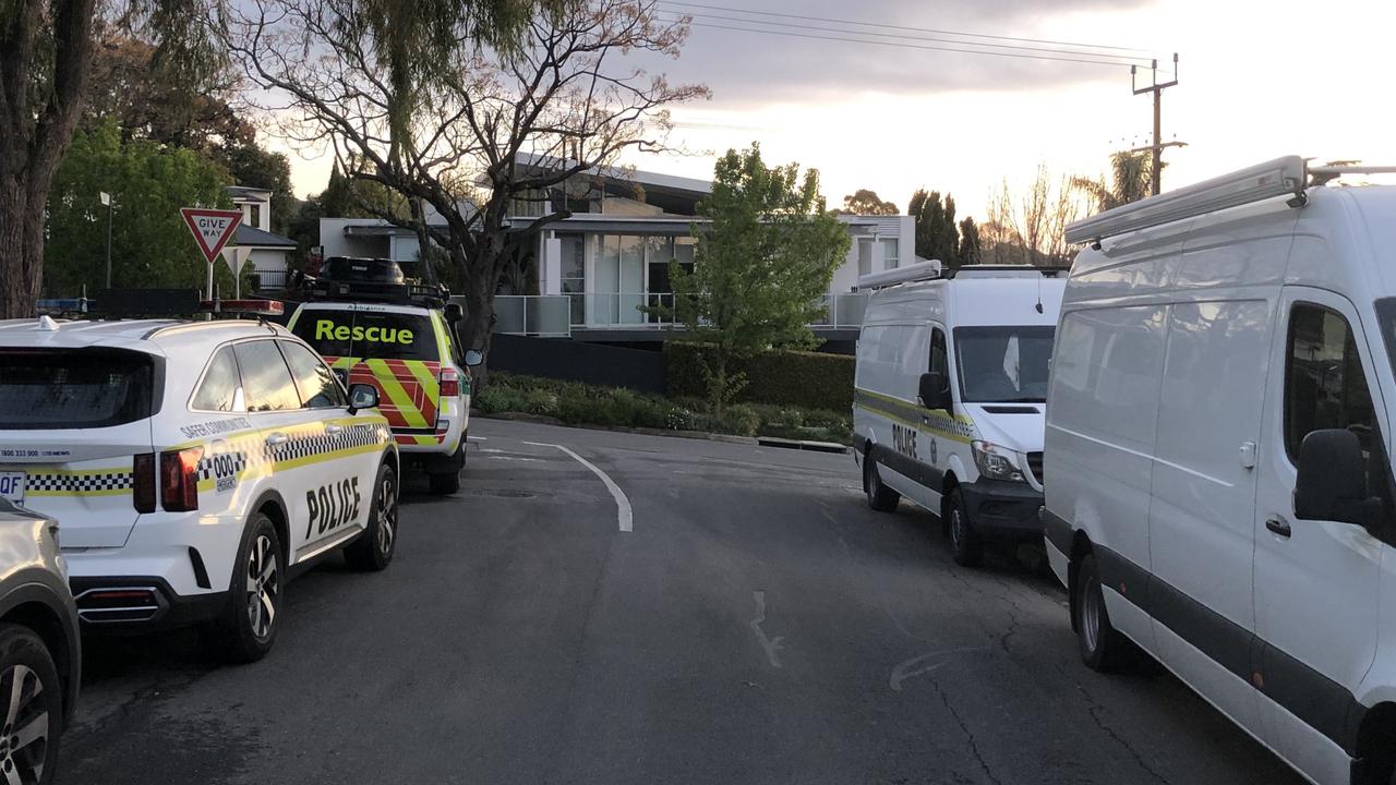 Police vans and detectives set up on Bagot St. A siege is unfolded in one of Adelaide’s most affluent suburbs as part of an investigation into a house break-in. Picture: SHASHI BALTUTIS