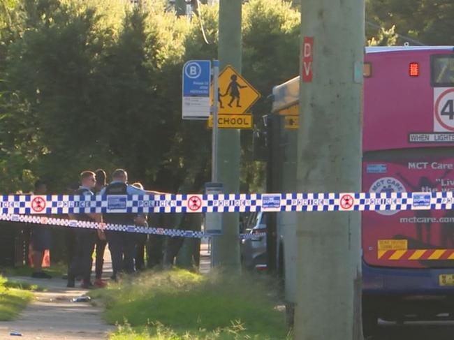 Police examined the bus and bus stop near a school on Power St, Doonside. Picture: TNV