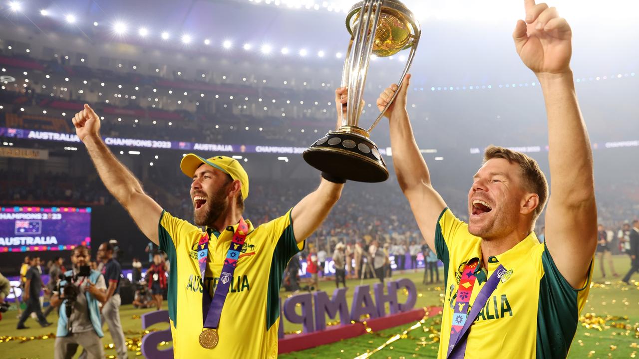 Maxwell and Warner with the World Cup trophy. Picture: Robert Cianflone/Getty Images