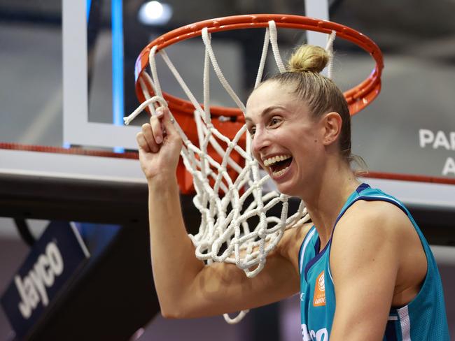 Flyers captain Rebecca Cole cuts the net after winning the WNBL Championship. Picture: Getty Images