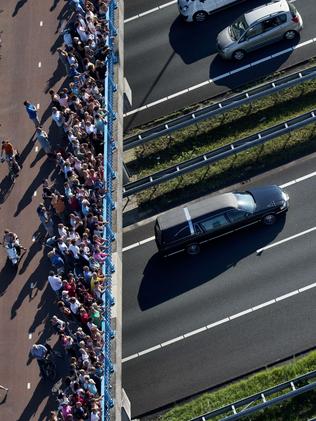 Crowds flock to see the convoy. Picture: AFP Photo/ANP/Jerry Lampen