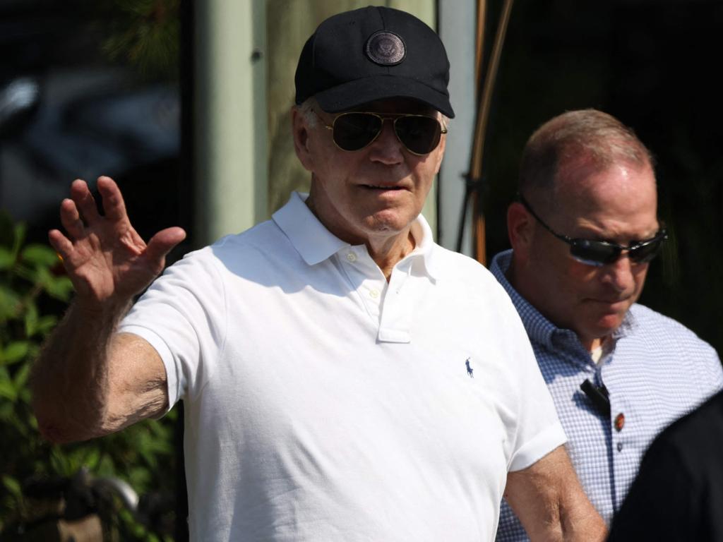 US President Joe Biden (L) waves as he departs the beach in Rehoboth Beach, Delaware, the day before his first TV interview since dropping out of the White House race. Picture: AFP