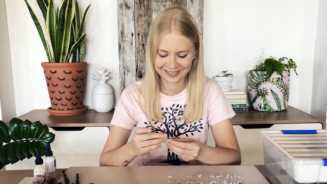 CRAFTY: Emma-Rose Pye, owner of Penny and Pebble, crafts a pair of her unique koala earrings.