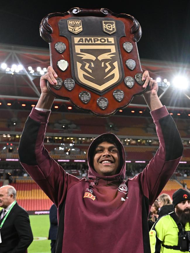 Selwyn Cobbo lifts the Origin trophy. Picture: Bradley Kanaris/Getty Images