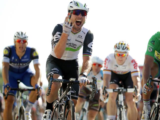 Mark Cavendish sprints to win his fourth stage at the Tour de France.