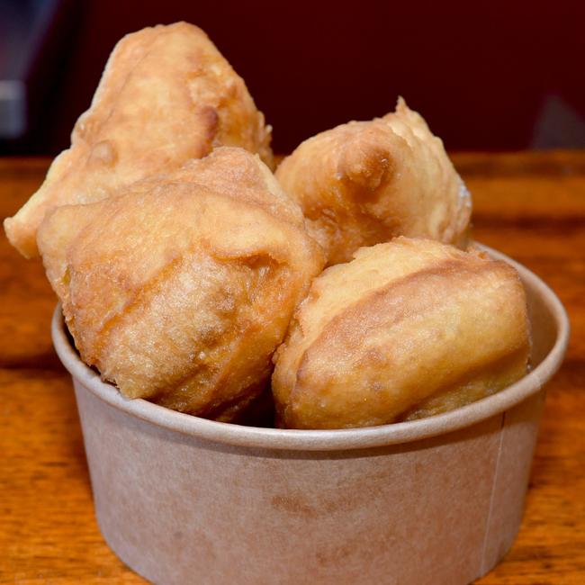 TASTE: Seafood Boil. Florrie Schwartz with traditional Torres Strait scones. Picture: Evan Morgan