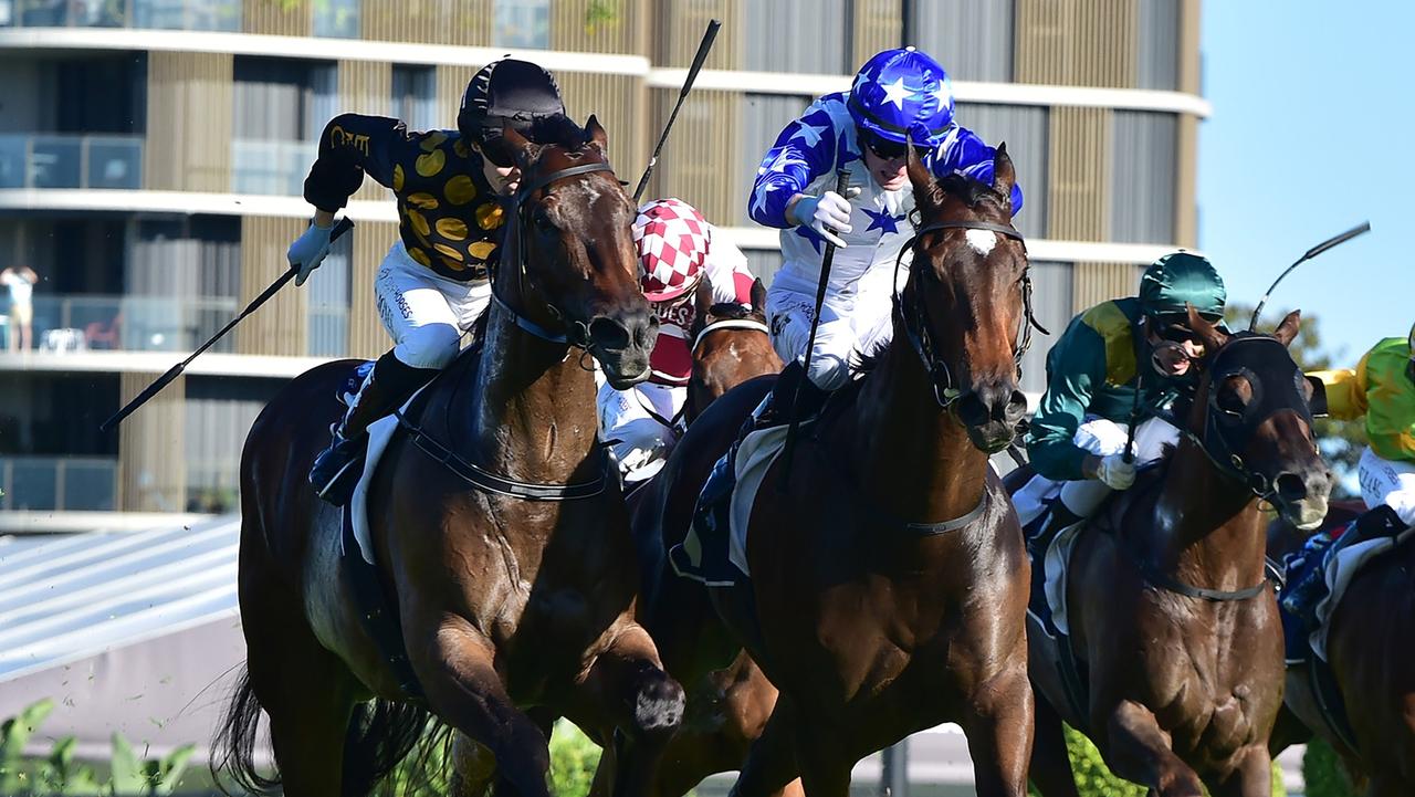 Golden Boom and Kyle Wilson-Taylor (right) get the better of Zarastro and Angela Jones in the Bribie Handicap at Eagle Farm. Picture: Grant Peters/Trackside Photography.