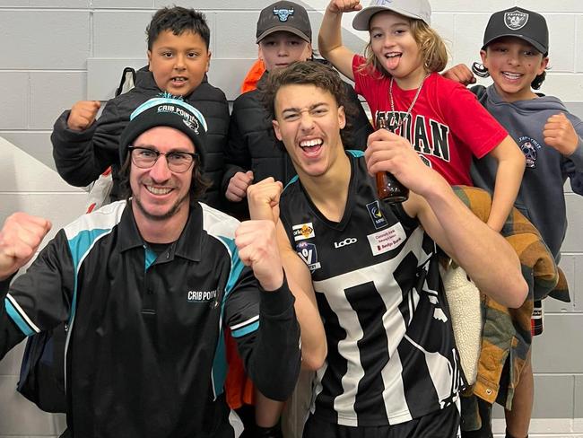 Crib Point's U9s celebrate with senior player Lee Sheehan and coach Andrew Gilmour after the club banked three wins for the day. Picture: Facebook