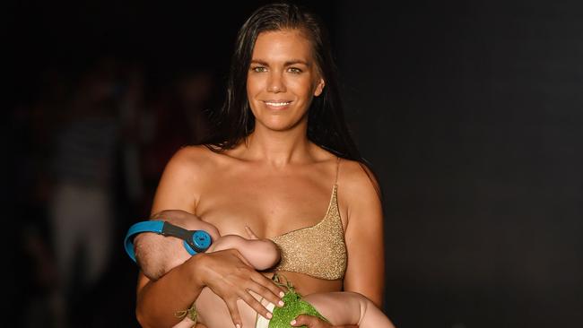 Mara Martin breastfeeds her baby while walking the catwalk at the 2018 Sports Illustrated Swimsuit in Miama. (Pic: MPI04/Capital Pictures/MEGA)