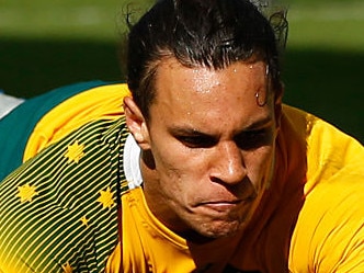 BIRMINGHAM, ENGLAND - SEPTEMBER 27: Matt Toomua of Australia dives over to score their tenth try during the 2015 Rugby World Cup Pool A match between Australia and Uruguay at Villa Park on September 27, 2015 in Birmingham, United Kingdom. (Photo by Stu Forster/Getty Images)