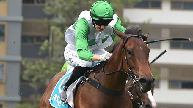 Rookie two-year-old Tony Gollan-trained filly Hi Barbie scores an emotional win at Doomben, with jockey Angela Jones in the saddle. Picture: Grant Peters / Trackside Photography