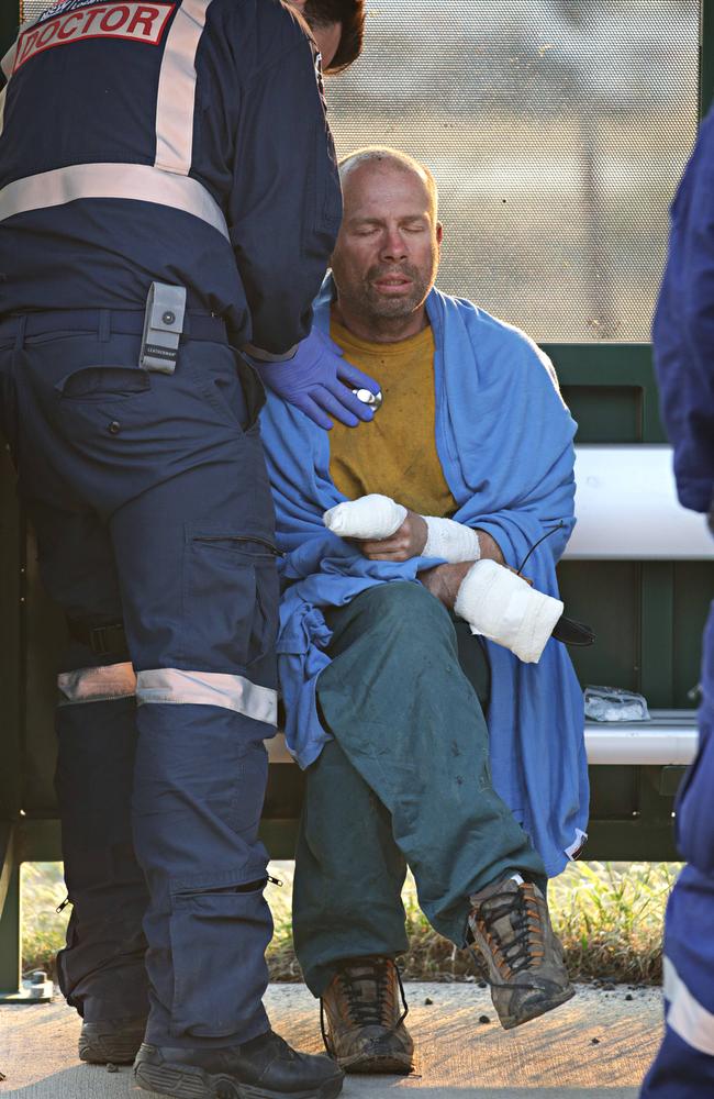 Mirek, a Wytaliba homeowner, is treated for burns. Picture: Adam Yip