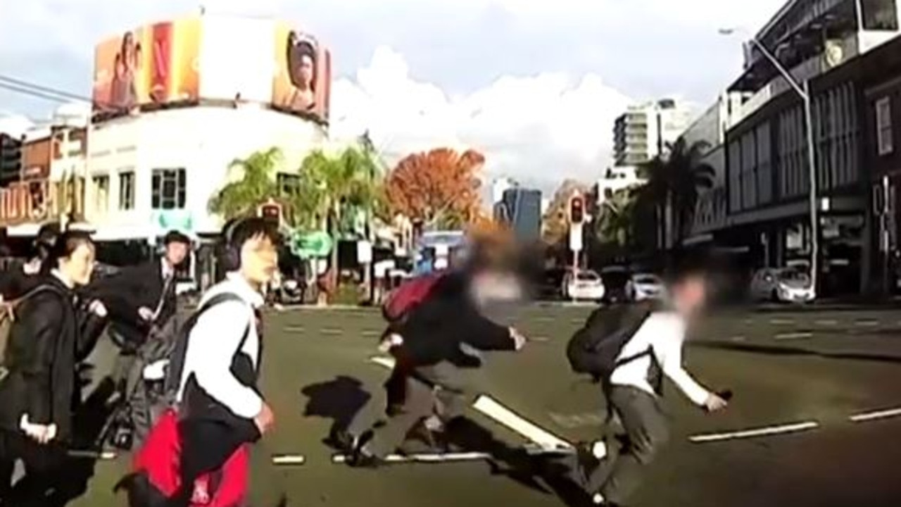 Three schoolboys race across the pedestrian crossing, appearing to look right moments before the crash. Picture: 7 News