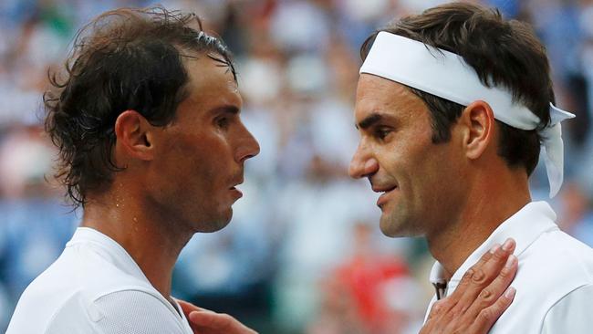 Spain's Rafael Nadal and Switzerland's Roger Federer embrace after Federer won their men's singles semi-final match in the 2019 Wimbledon Championships Picture: Adrian Dennis/POOL/AFP