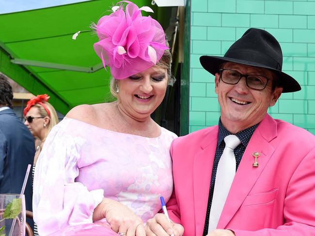 Katie and Phil Tighe are seen studying the form guide in the Birdcage on Melbourne Cup Day at Flemington Racecourse, in Melbourne, Tuesday, Nov. 3, 2015. Picture: AAP Image/Dan Himbrechts