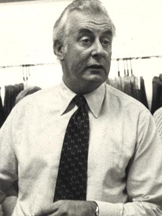 March 1974. Prime Minister Gough Whitlam buying a pair of bathers. Neg: GC02132