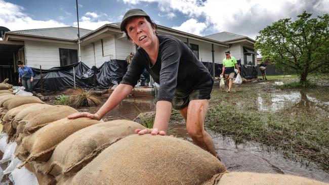 Goulburn Rd Home owner Kim Hay surveys the sandbags protecting her home. Picture: David Caird