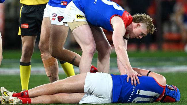 MELBOURNE, AUSTRALIA – SEPTEMBER 07: Angus Brayshaw of the Demons lays on the ground knocked out during the AFL First Qualifying Final match between Collingwood Magpies and Melbourne Demons at Melbourne Cricket Ground, on September 07, 2023, in Melbourne, Australia. (Photo by Quinn Rooney/Getty Images)