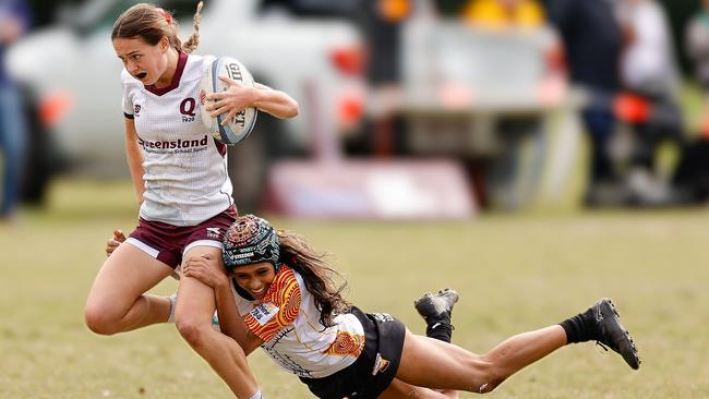 Aamira Renouf (Lloydies) make another of her numerous do-or-die tackles against her Queensland White opponent and friend Lilly Bain at the Australian Schools Rugby Championships. Picture: Rachel Wright