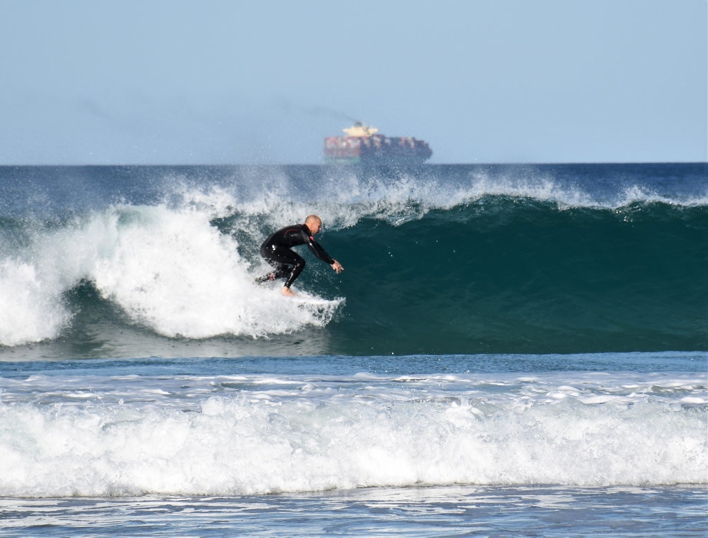 Surfers and bodyboard riders making the most of the waves at Kawana on the weekend. Picture: Mark Furler