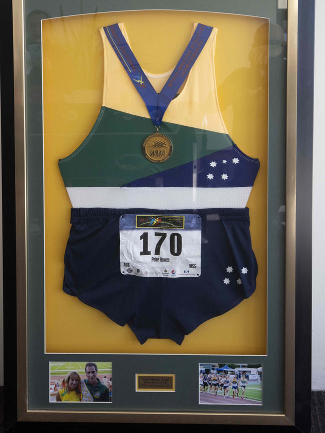 Also in the games room is a framed running suit, which he wore in Sacramento in 2011. Picture: Glenn Hunt