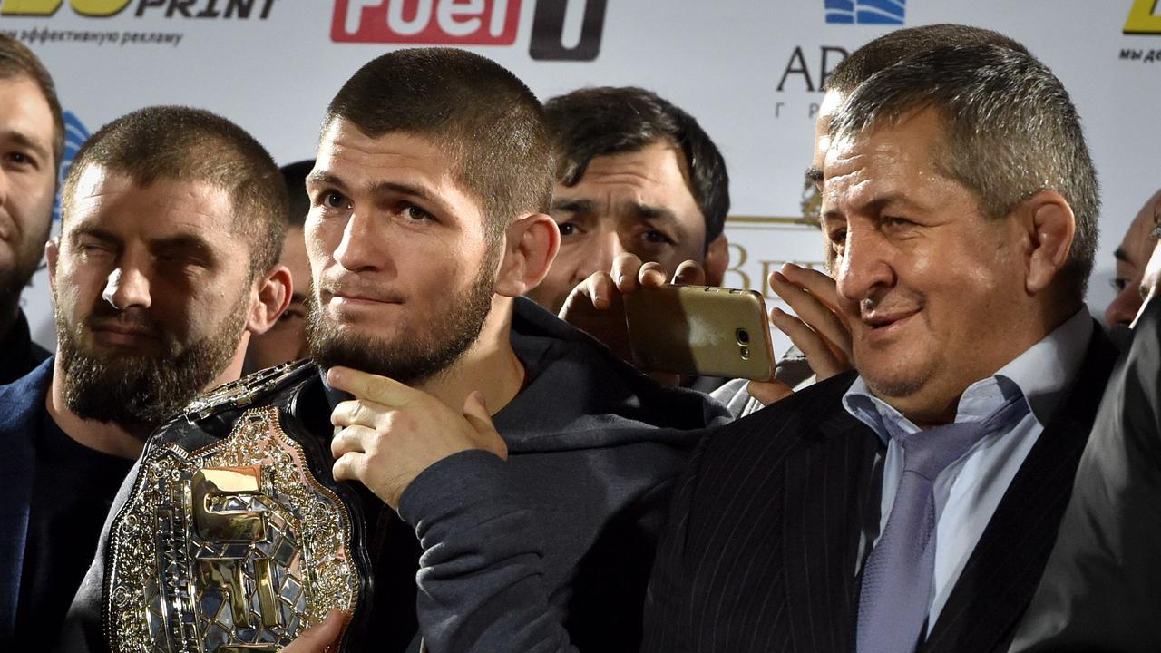 UFC lightweight champion Khabib Nurmagomedov (C) with his father Abdulmanap (R), who tragically passed away in July.