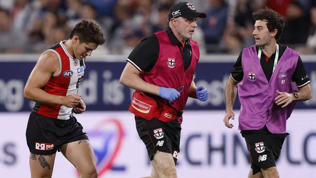 St Kilda defender Liam Stocker (left) runs off sore after his final quarter collision with Patrick Dangerfield on Saturday, which gave the Cats skipper a free kick. Picture: Darrian Traynor / Getty Images