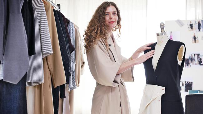 Australian fashion designer Bianca Spender working on her latest creation in her office in Darling Point today. Picture: Sam Ruttyn