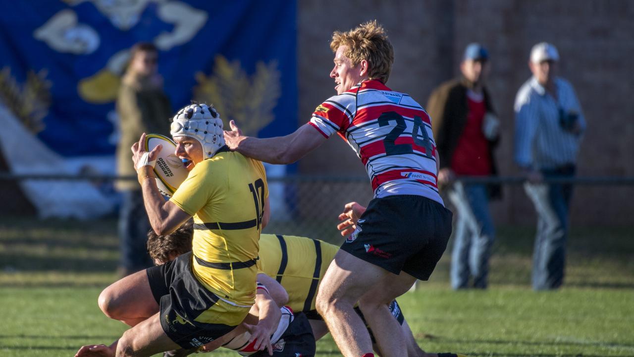 Michael Jamieson is tackled.