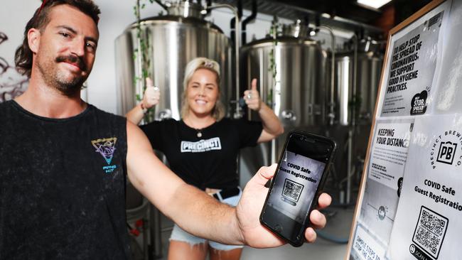 Patron Jesse Waddington and worker Amy Clements at Precinct Brewing Co. Picture: Scott Powick