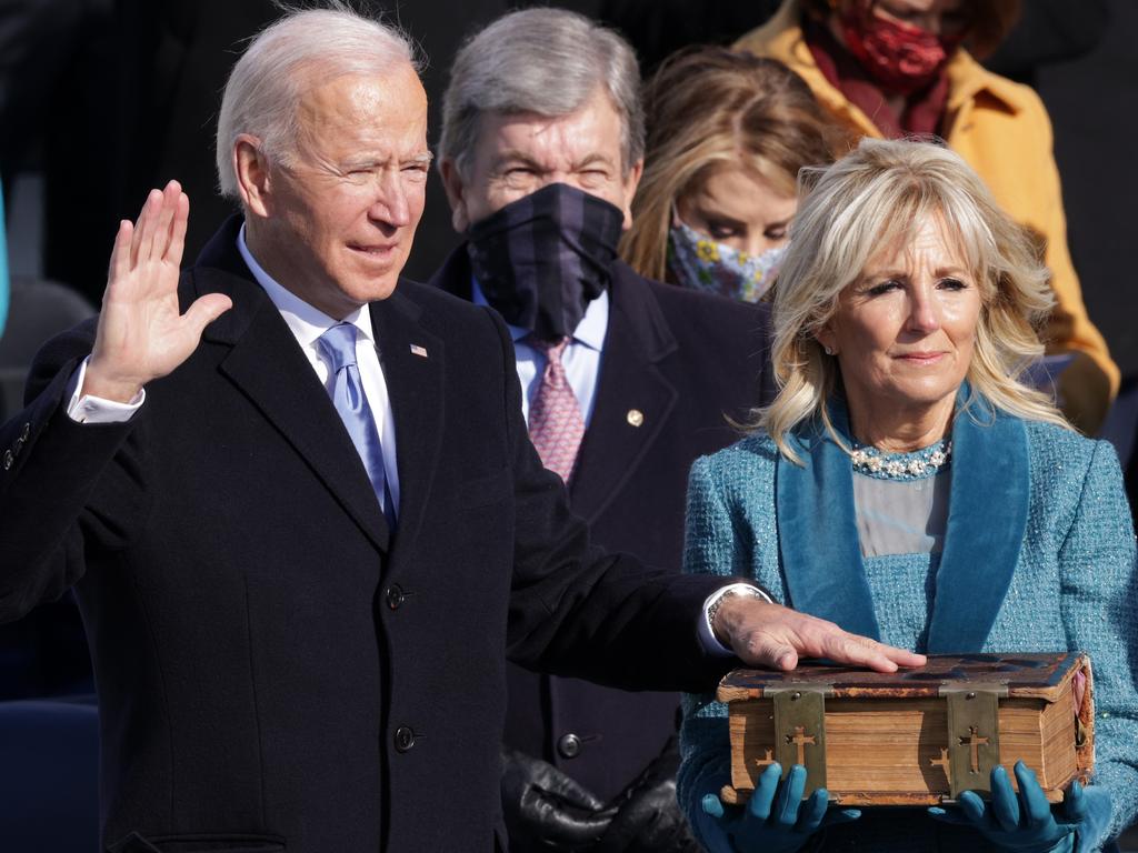 Joe Biden is sworn in as US President during his inauguration on the West Front of the US Capitol in Washington, DC. His wife Dr Jill Biden by his side. Picture: Getty Images